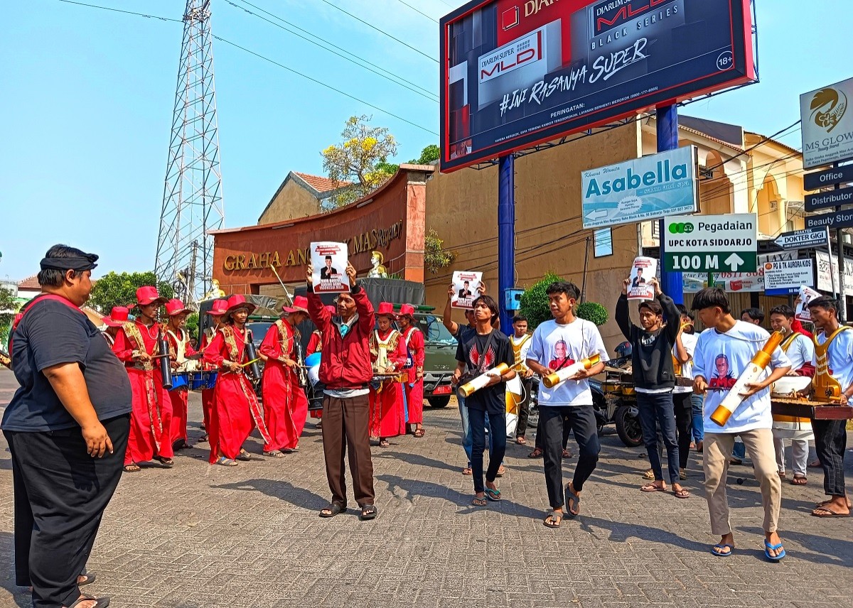 Pendukung Ganjar menggelar Musik Patrol di Sidoarjo. (Foto: Ahaddiini HM/jatimnow.com).