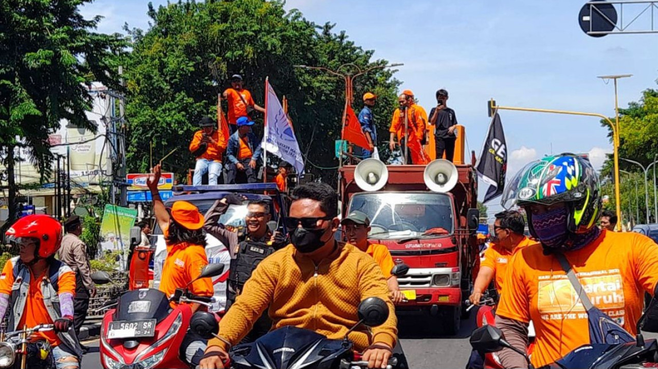 Aksi hari buruh di Sidoarjo. (Foto: Ahaddini HM/jatimnow.com)