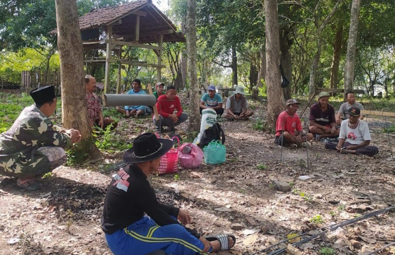 Tradisi slametan warga Desa Ngelo Kecamatan Margomulyo Bojonegoro saat mendapatkan bantuan fasilitas air bersih. (Foto: Ibrohim for jatimnow.com)
