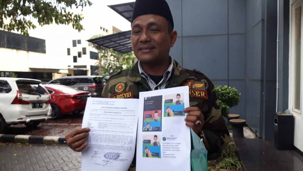 Sekretaris Bidang Kerjasama Satkorwil Banser Jatim, Abdul Rasyid di Polda Jatim, Senin (18/3/2019)