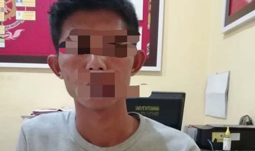 Tersangka HW diamankan di kantor polisi