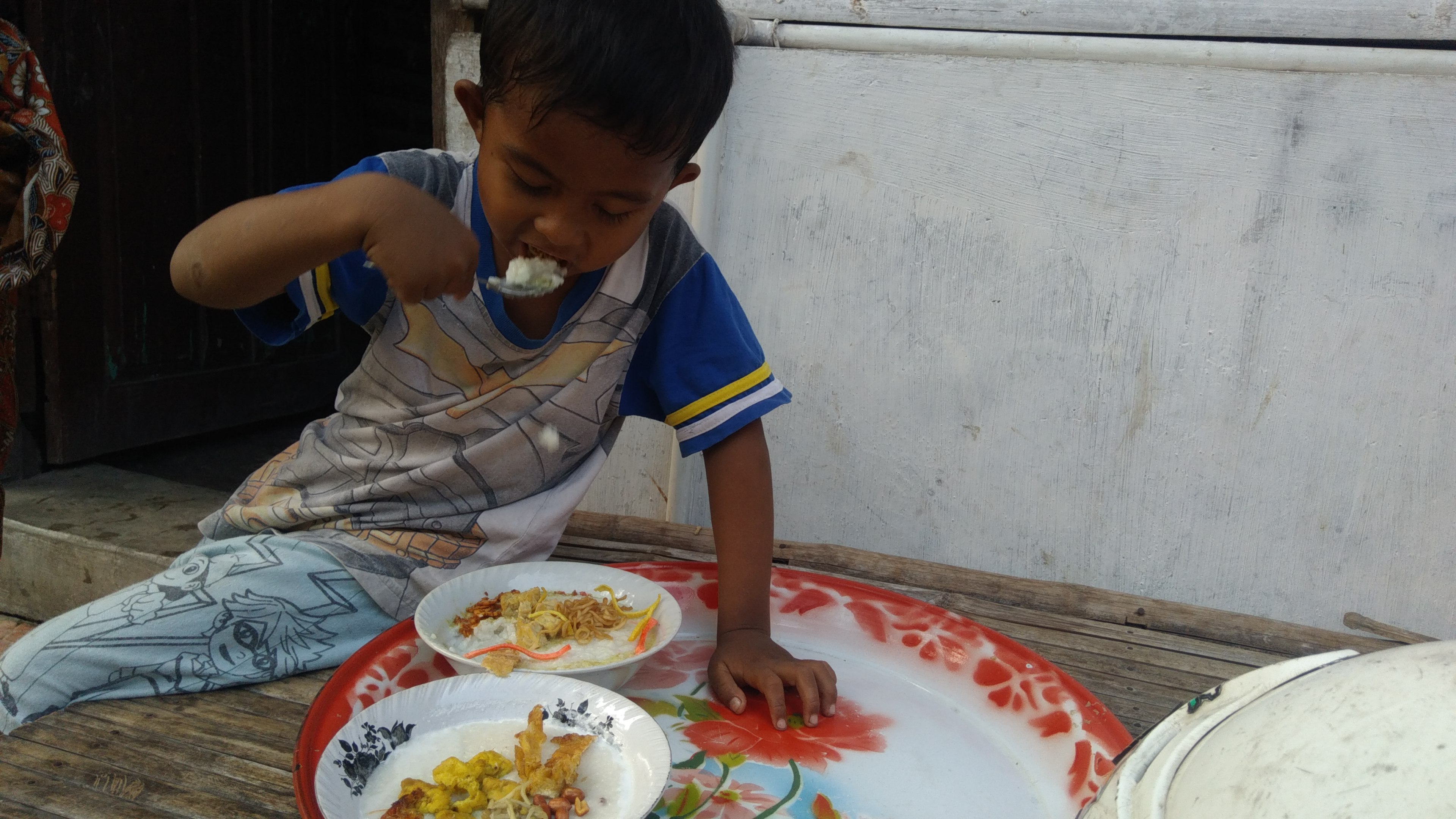 Bubur Suro dengan topingnya yang khas