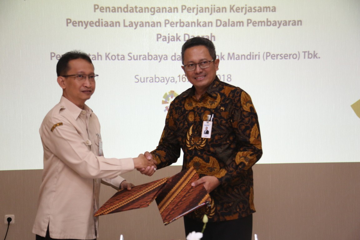 Proses penandatanganan perjanjian kerjasama penyediaan layanan perbankan dalam pembayaran pajak daerah. 