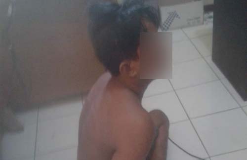 Didik saat diamankan di kantor polisi.