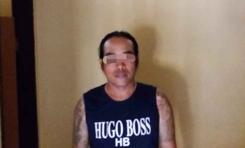 Tersangka saat berada di Mapolres Blitar