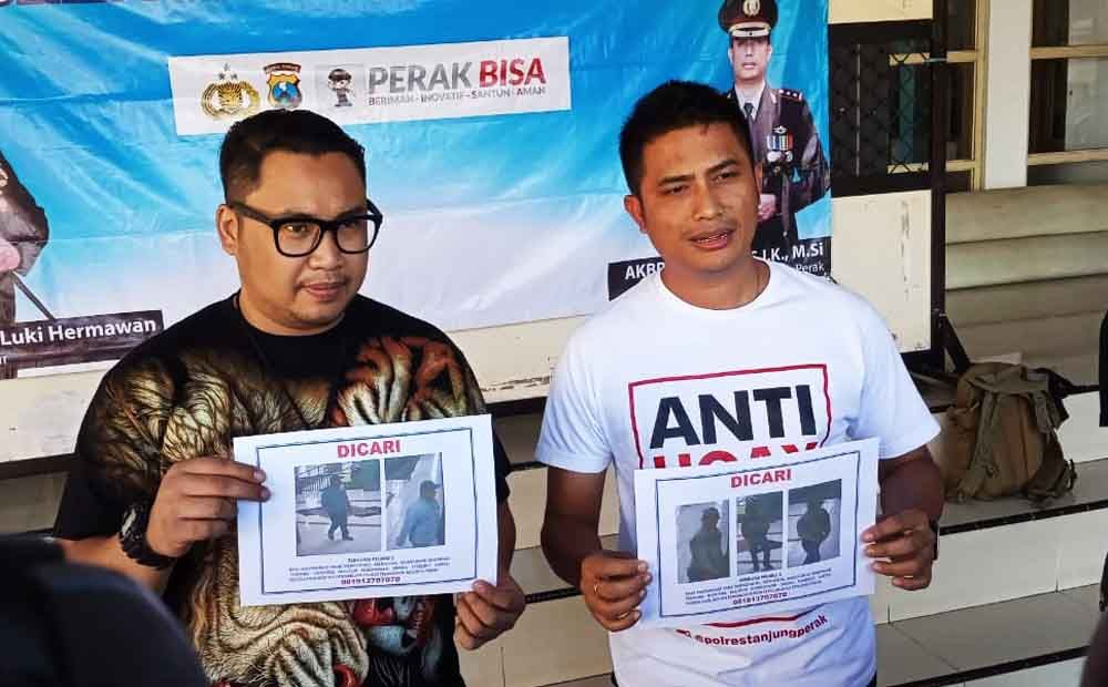 Polisi menunjukan foto dari rekaman CCTV yang diduga pelaku pembunuhan Wartawan di Surabaya